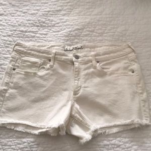 White cutoff denim shorts